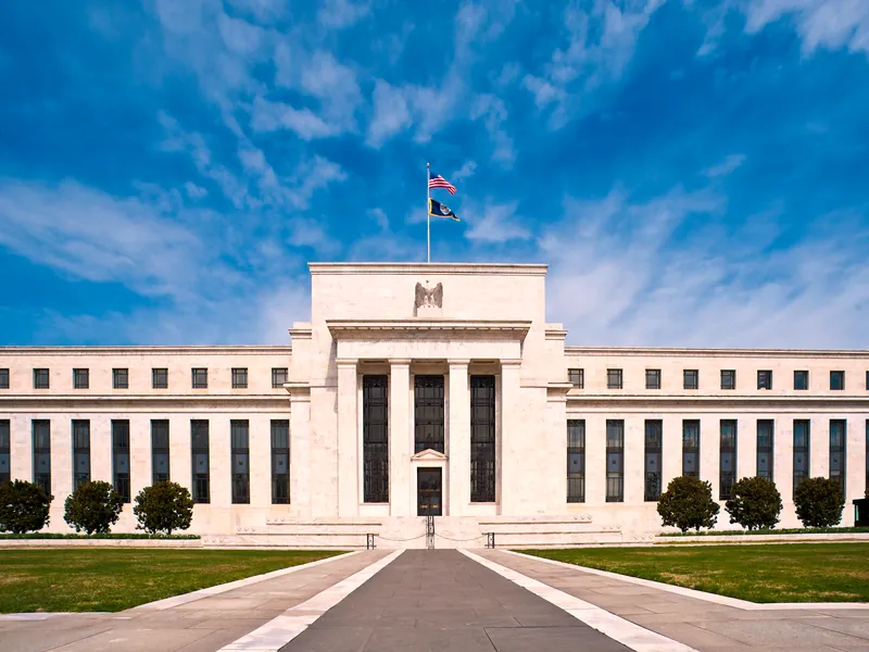 The Eccles Building, headquarters of the US Federal Reserve in Washington, DC, under a blue sky